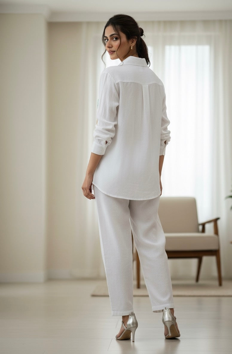 WHITE LINEN COLOURFUL THREAD EMBROIDERED AND EMBELLISHED CO-ORDS BESU INDIA